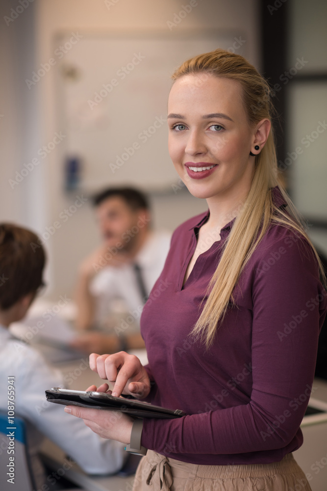 blonde businesswoman working on tablet at office blonde businesswoman working on tablet at office