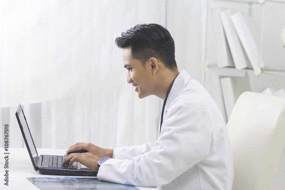 Medical doctor working with laptop in the office Medical doctor working with laptop in the office