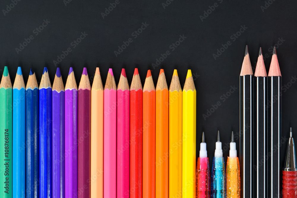 Pencil crayons on black background