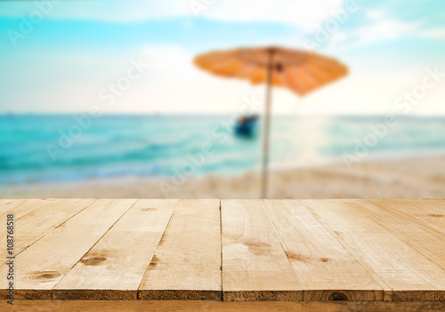 image of wooden table in front of Summer sea in Thailand