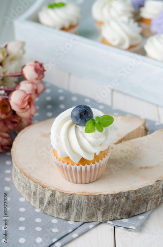 Summer cupcakes with blueberries and mint flavoured cream. Homemade.