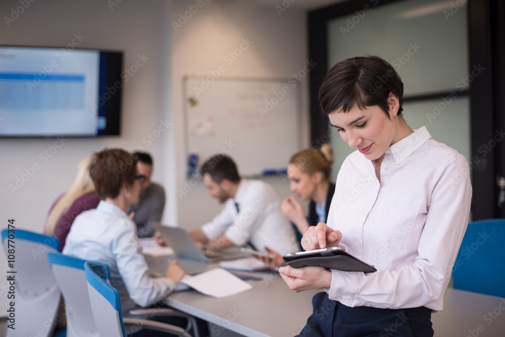 business woman on meeting  using tablet