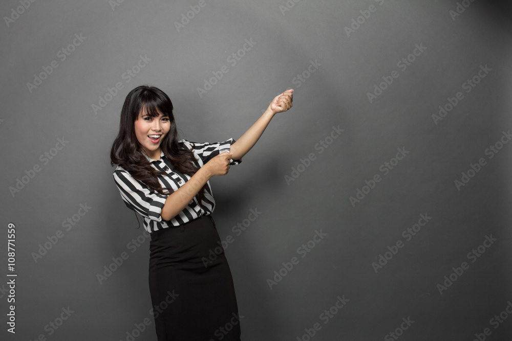 Young businesswoman pulling out somthing Young businesswoman pulling out somthing