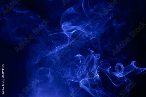 Blue smoke on a black background.
