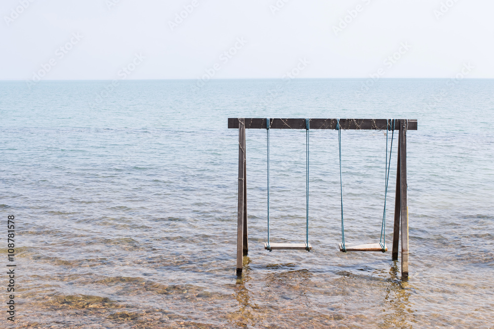 Swing above the sea on the beach Swing above the sea on the beach