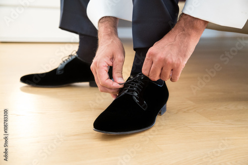 groom in elegant shoes