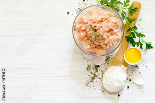 Healthy food background, raw minced meat and different spices on