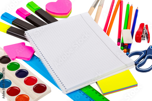 Stationery isolated on white. Notebooks, markers, pencils, rulers, stickers, stapler
