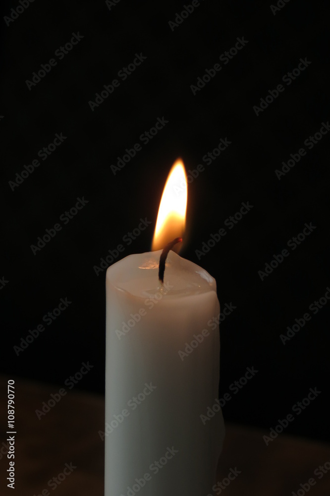 Candle lit on a restaurant table Candle lit on a restaurant table