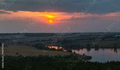 Panorama of the river, fields and forests on the background of a © Oleg Zhukov