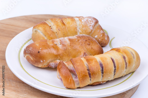 Homemade sweet baked rolls buns copy space over white