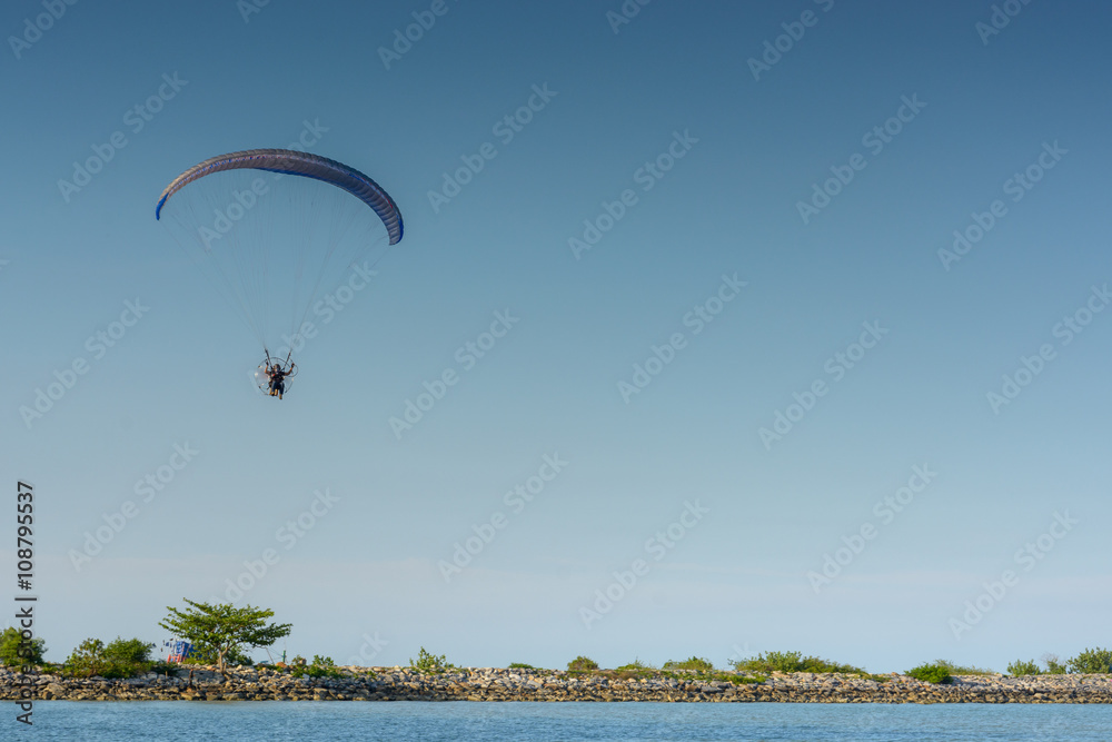 Paramotor on the sky in the evening:Close up,select focus with s Paramotor on the sky in the evening:Close up,select focus with s