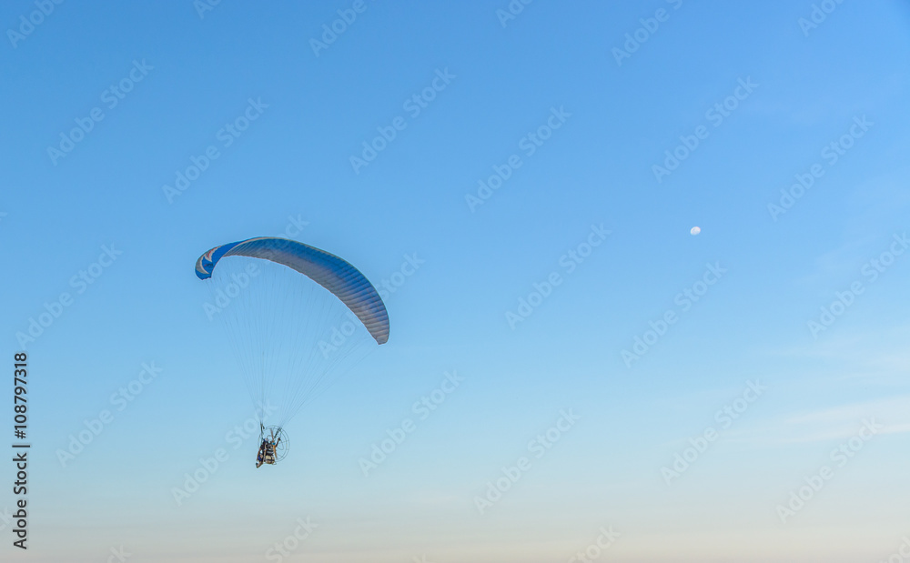 Paramotor on the sky in the evening:Close up,select focus with s Paramotor on the sky in the evening:Close up,select focus with s