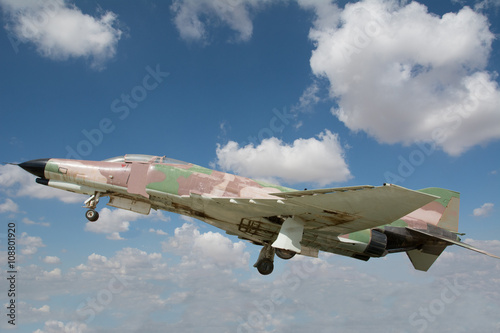 F-4 Phantom fighter against a clear blue sky