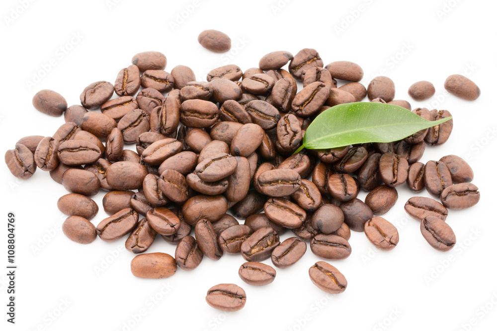 Coffee grains and leaves isolated on the white backgrounds. Coffee grains and leaves isolated on the white backgrounds.