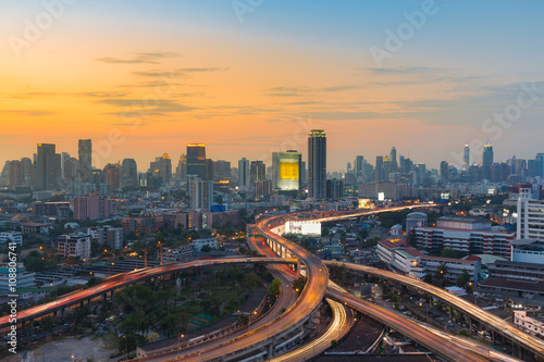 Aerial view city downtown background, highway interchanged, long exposure © pranodhm