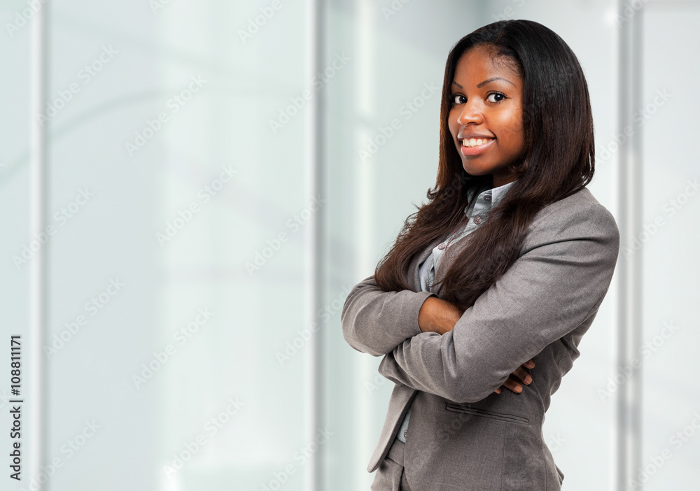 Smiling black businesswoman in her office