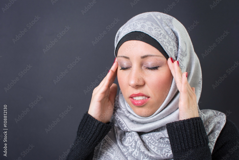 Muslim woman with a headache