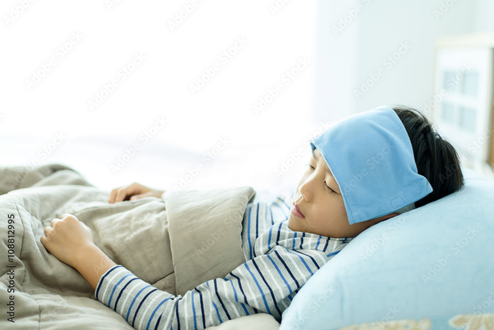 Sick boy on the bed Sick boy on the bed