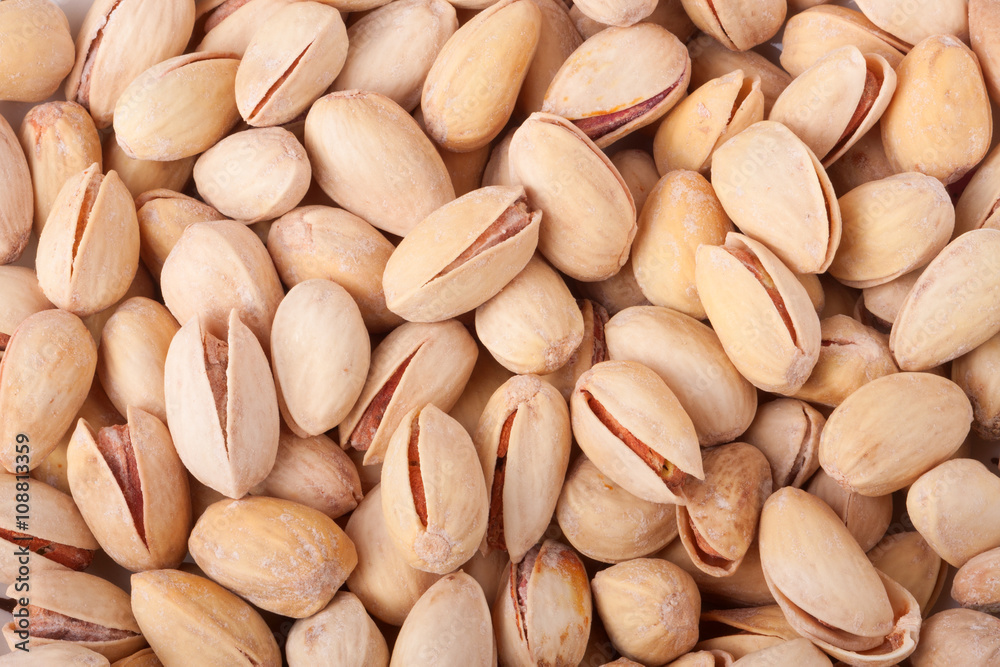 Pistachio nuts as a background close up macro Pistachio nuts as a background close up macro