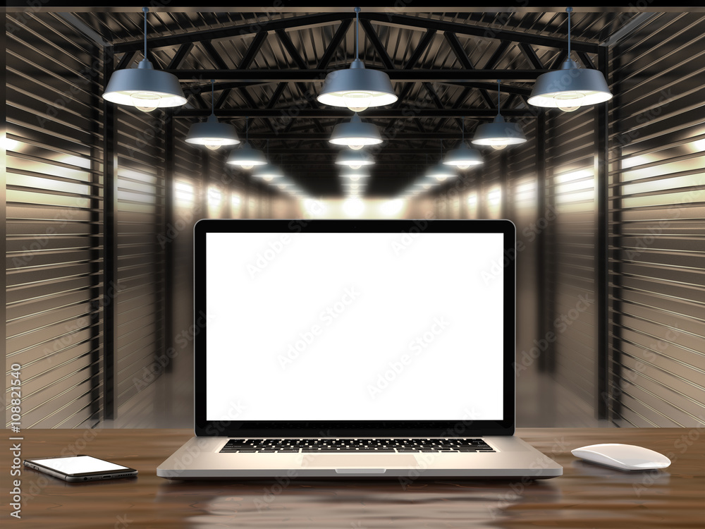Fototapeta premium Laptop and smartphone with blank screen on table.
