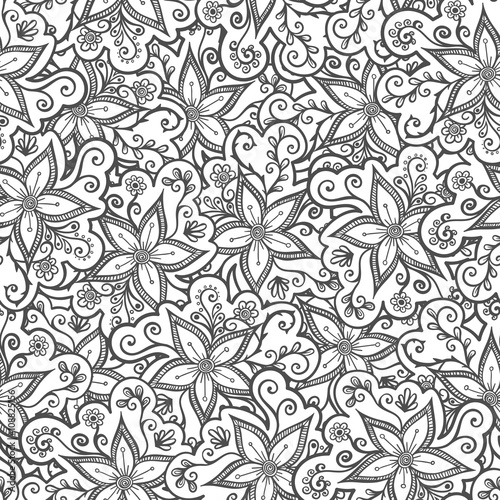 Doodled seamless vector pattern from flowers.  Endless vector background nature theme. Hand drawn floral abstract pattern