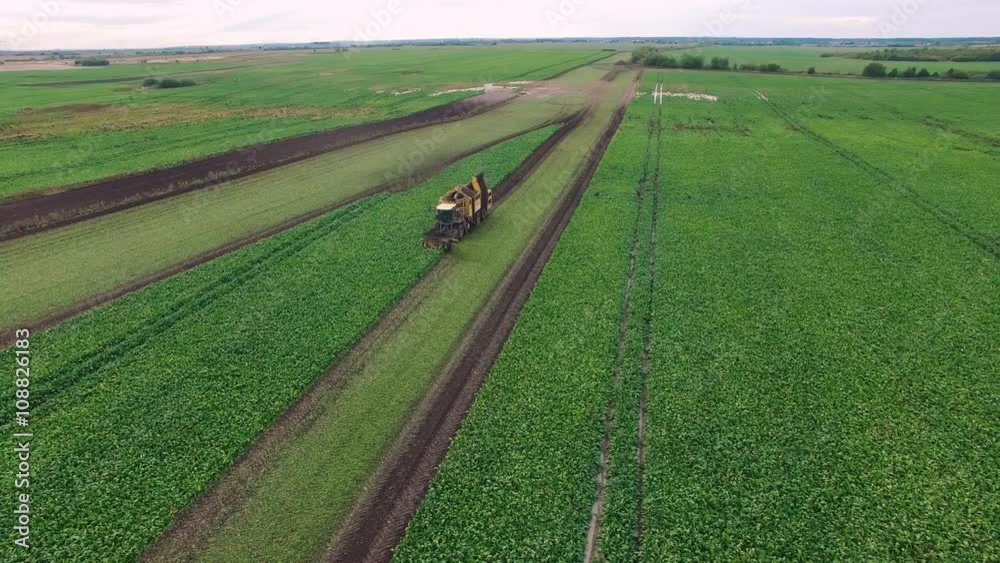Drone flight aerial bird eye view of tractor blue sky in the background helicopter view and using very high resolution 4k camera Drone flight aerial bird eye view of tractor blue sky in the background helicopter view and using very high resolution 4k camera