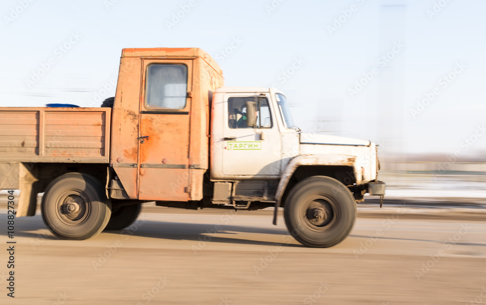 Blurred Moving Russian Industrial Vehicle