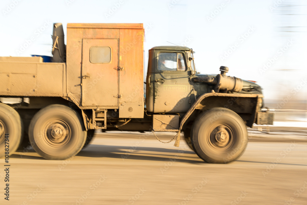 Blurred Moving Russian Industrial Vehicle