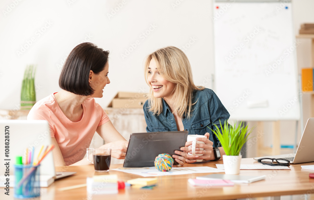 Pretty female colleagues are making a break Pretty female colleagues are making a break