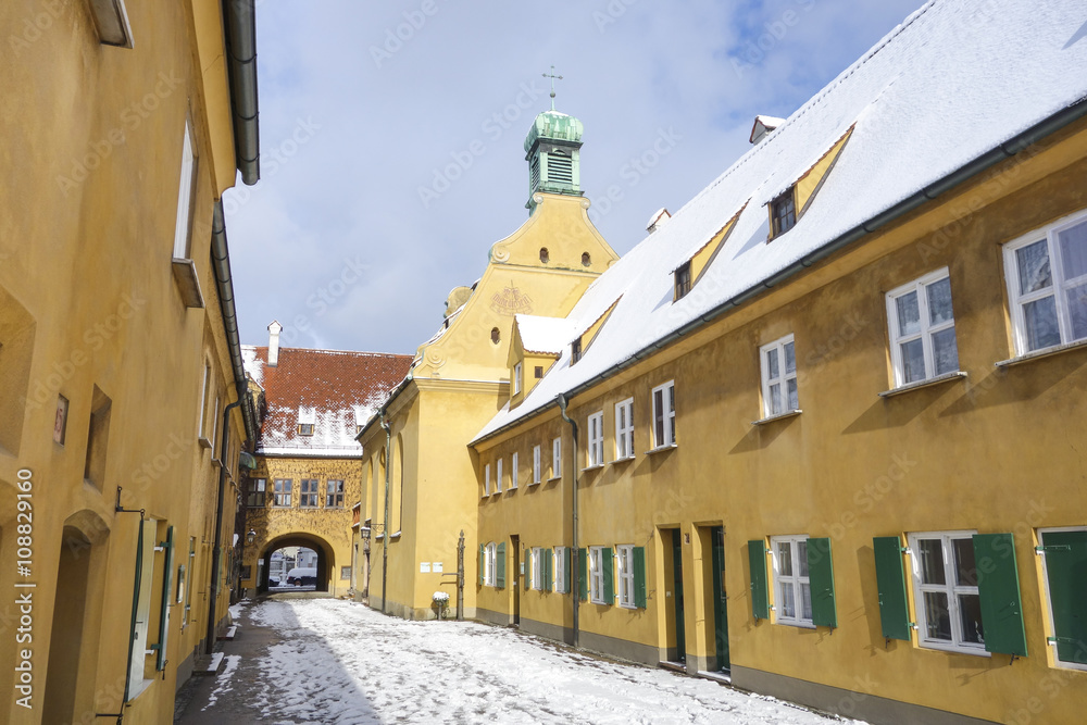 Small street in the Fuggerei district in Augsburg, Germany - obrazy, fototapety, plakaty 