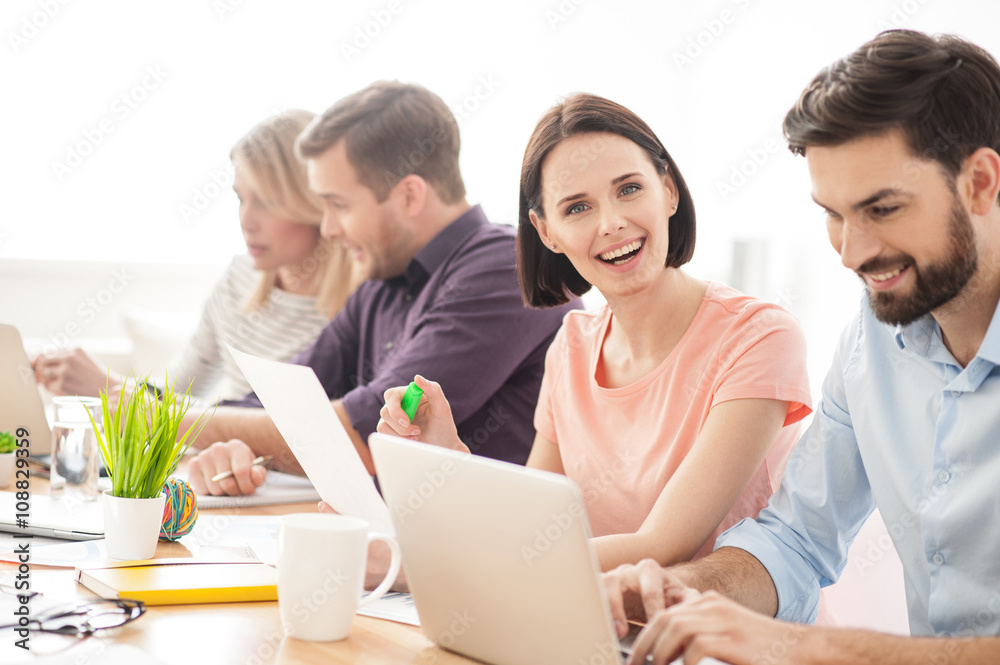 Skillful four colleagues are discussing a project Skillful four colleagues are discussing a project