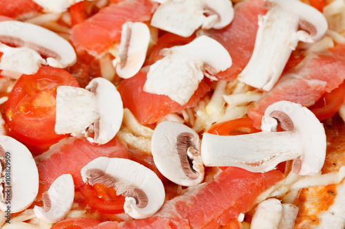 Cooking homemade pizza with...