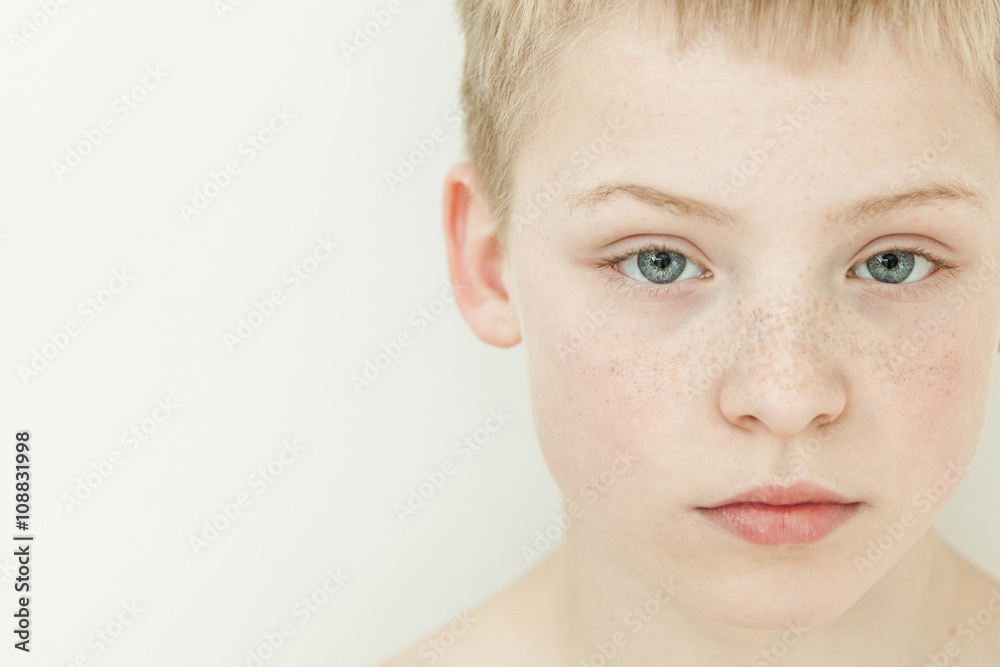 Close up on freckled blond child Close up on freckled blond child