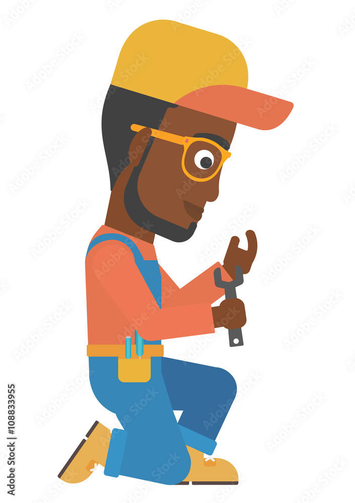 Repairman holding spanner. Repairman holding spanner.