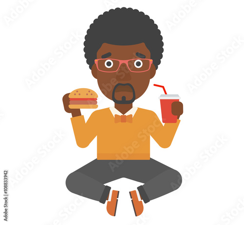 Man eating hamburger. 