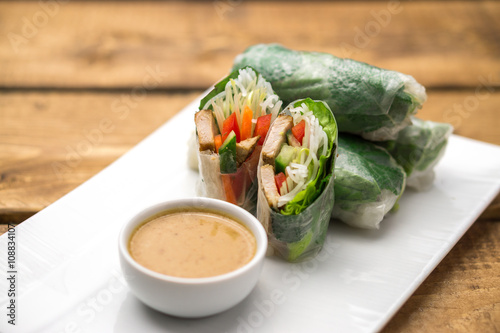 Vietnamese Spring Rolls. These are great as an healthy appetizer or lunch. Served with peanut butter sauce. photo