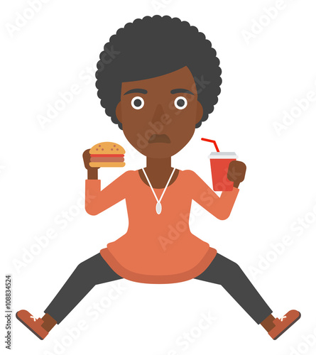 Woman eating hamburger. 
