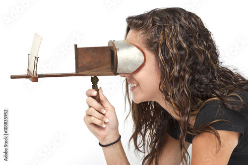 teen girl using stereoscope