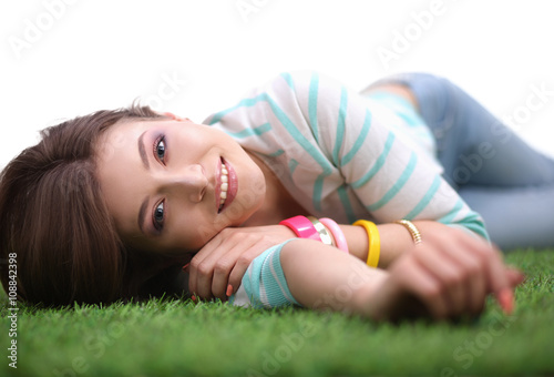 Top view of beautiful young woman holding hands behind head