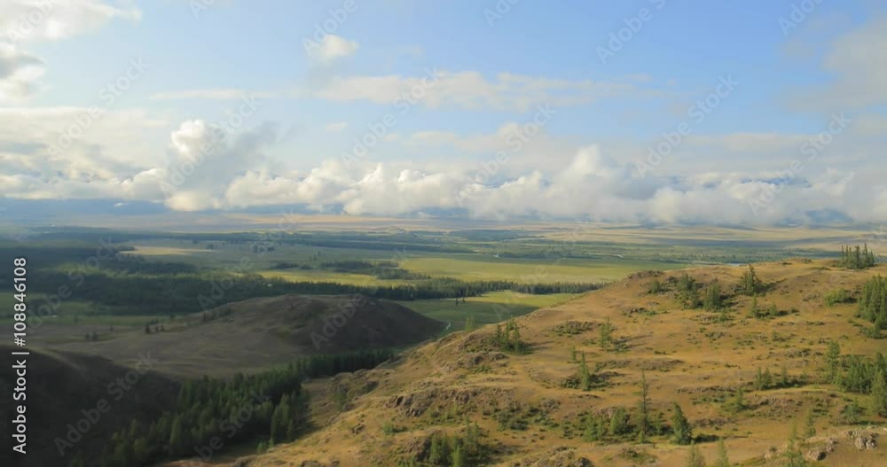 Flying in cloudy weather over the river, forest and mountains Flying in cloudy weather over the river, forest and mountains