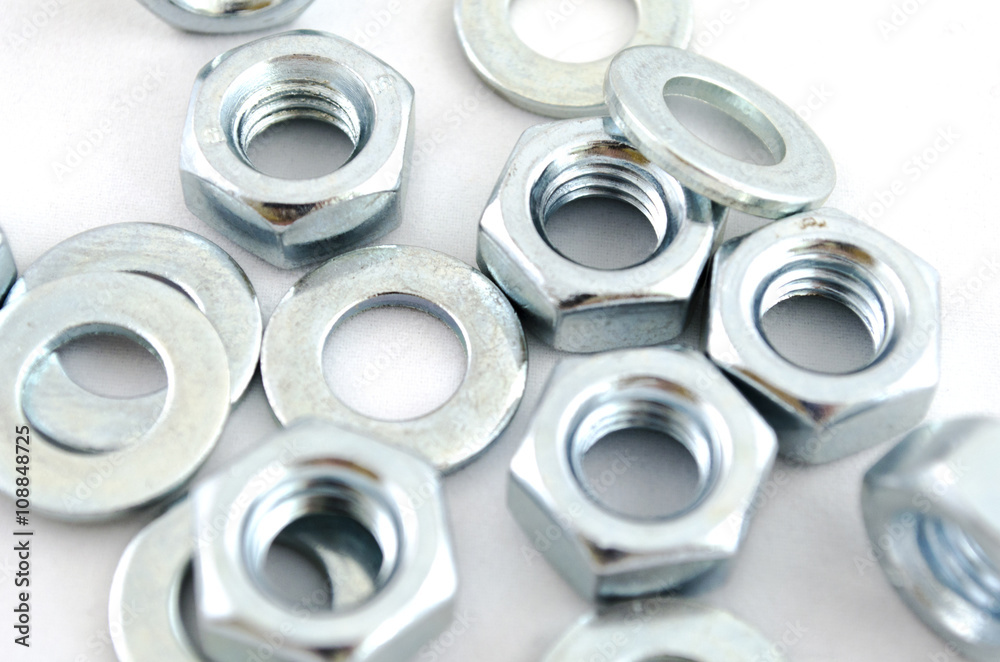 Several metal screw washers and nuts Several metal screw washers and nuts