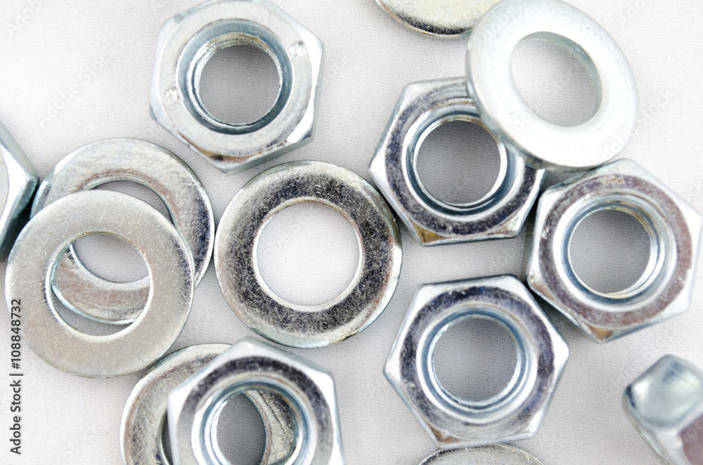 Several metal screw washers and nuts Several metal screw washers and nuts