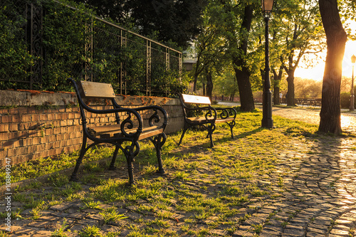 Benches in a Vienna park at sunset
