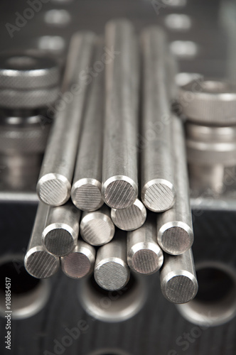 stainless steel rods on a welding table