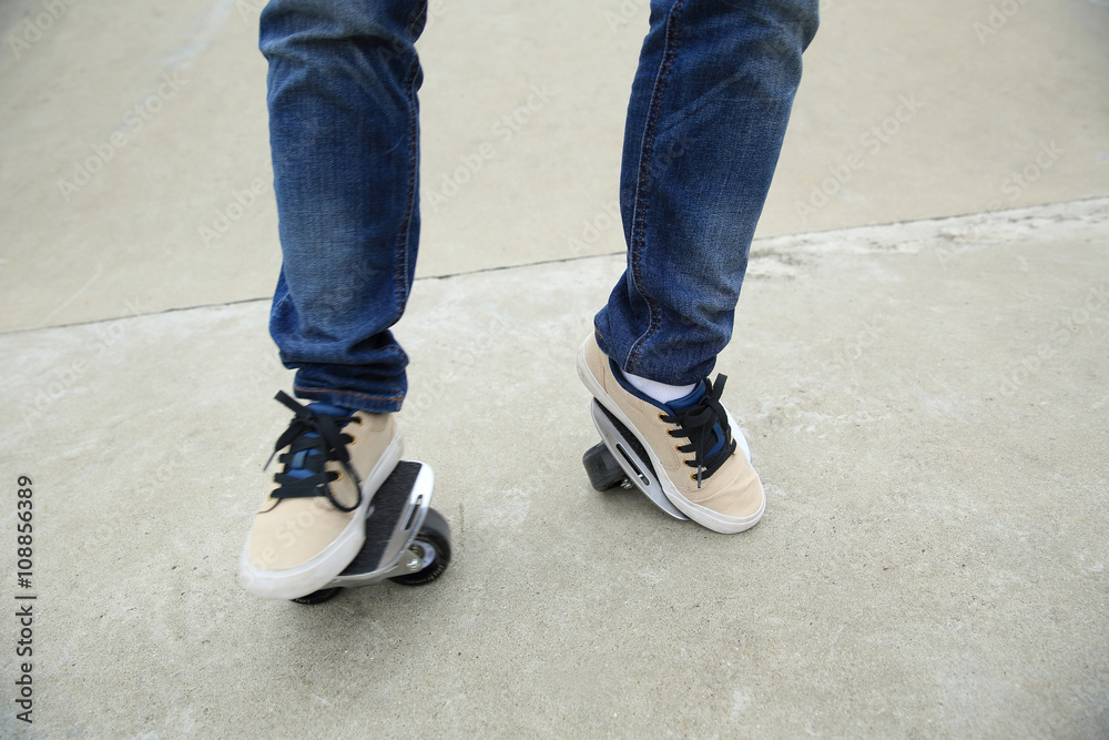 skateboarding legs riding on freeline at skatepark