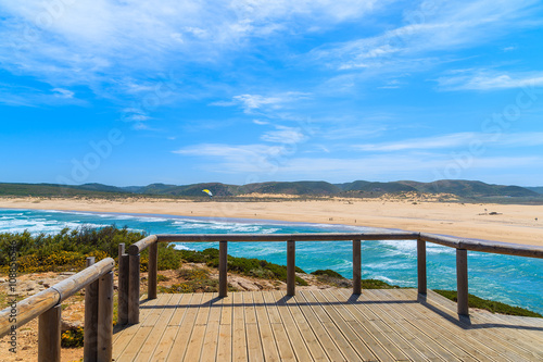 Wooden platform and view of sandy Praia do Bordeira beach  Algarve region  Portugal