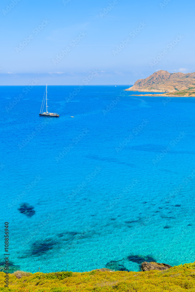 A yacht boat on in Ostriconi sea bay, Corsica island, France A yacht boat on in Ostriconi sea bay, Corsica island, France