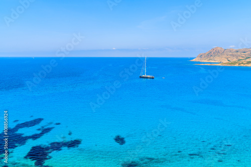 A yacht boat on in Ostriconi sea bay, Corsica island, France