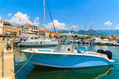 Boats in Saint-Florent port, a small cozy fishing village in northern Corsica, France photo